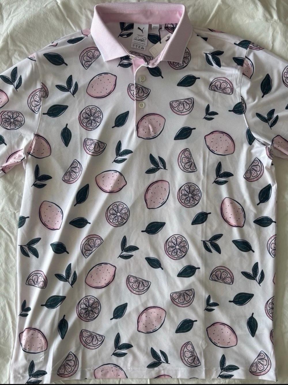 Puma Men’s Pink Citrus Print Polo with Dark Green Leaf Accents